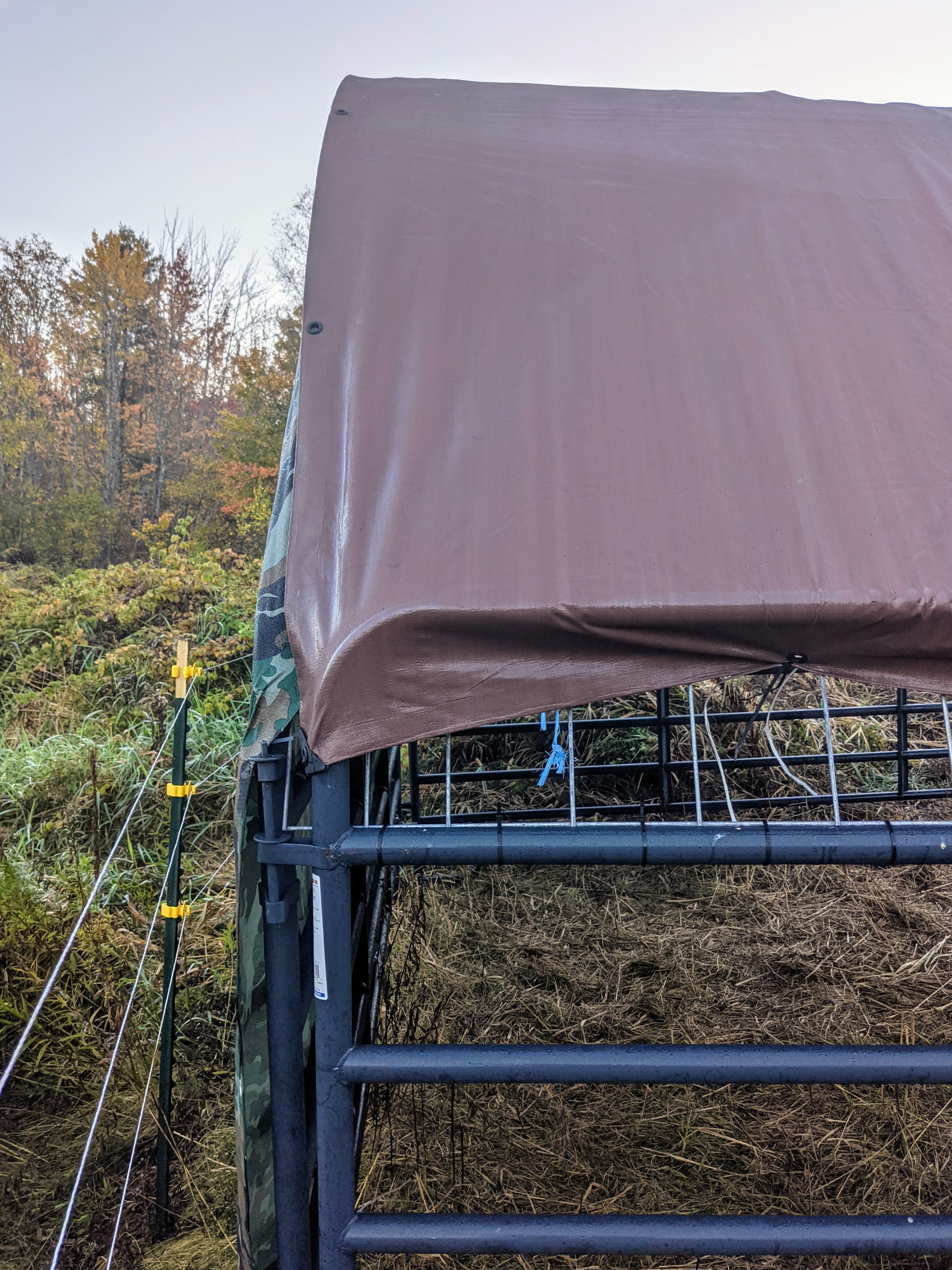 Roof tarp pulled tight and secured with zip ties
